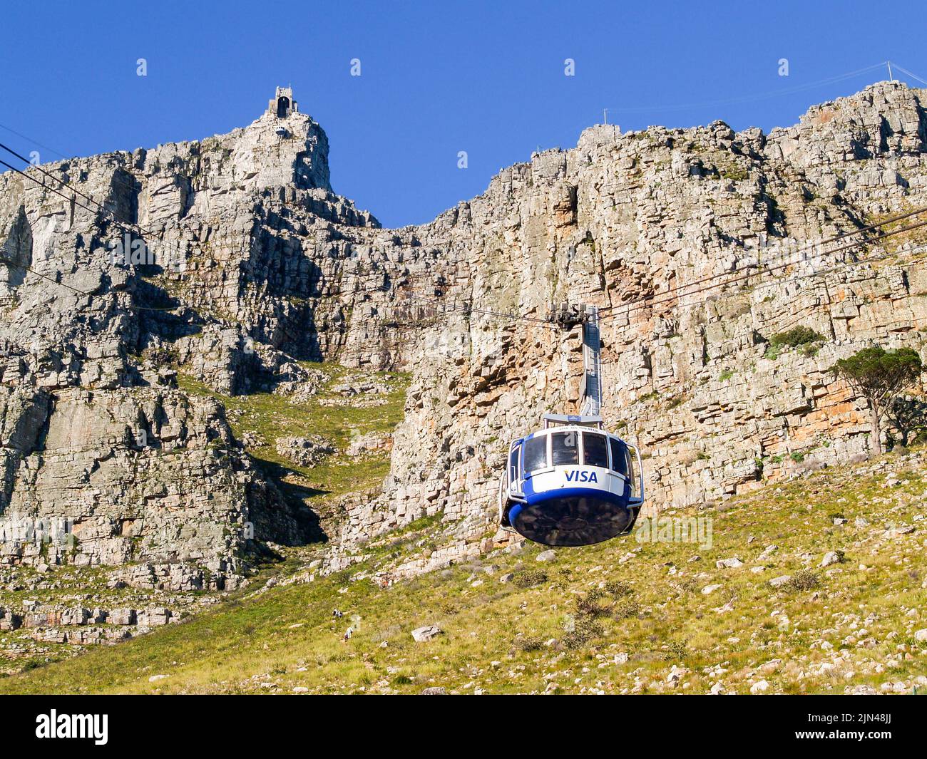 Capetown South Africa - August 25 2007; Table Mountain with Visa sponsored cable car rising to station at top of famous landmark. Stock Photo