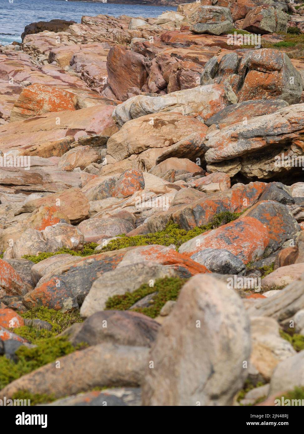 Rocks and large boulders on coastal edge at Cape of Good Hope, South Africa. Stock Photo