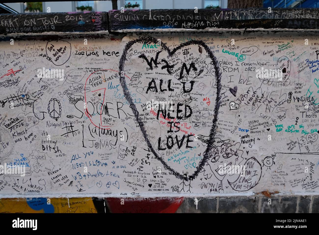 London, UK, 8th Aug, 2022. Messages written on the wall outside Abbey Road studios by fans.  Fifty three years ago to the day on the 8th August 1969, photographer Iain Macmillan took shots of the group walking across the zebra crossing that is close to the recording studio creating the iconic album cover image for 'Abbey Road'. Credit: Eleventh Hour Photography/Alamy Live News Stock Photo
