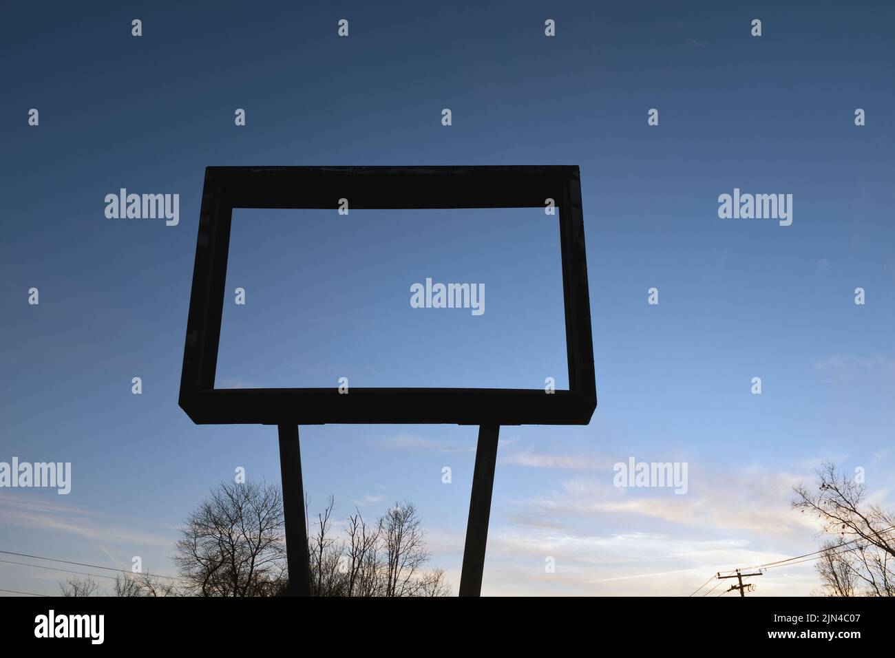 Low Angle View of Old Metal Sign Frame with No Message against Blue Sky Stock Photo