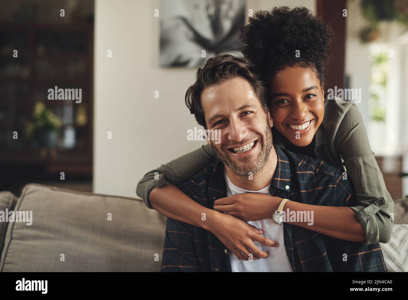 We bring nothing but happiness into each others lives. Portrait of an affectionate young couple spending the day together at home. Stock Photo
