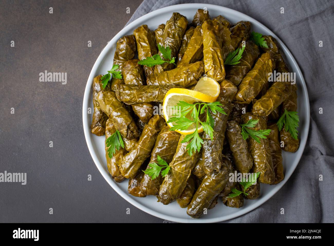 Delicious dolma (sarma) stuffed grape leaves rice, white yogurt sauce