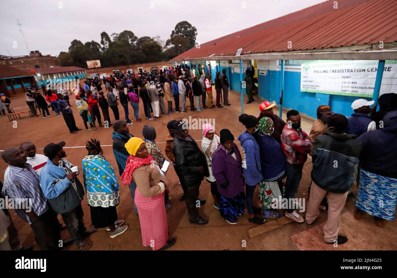 Voters queue before casting their ballots during the general election by the Independent Electoral and Boundaries Commission (IEBC) at the Kibera primary school in Nairobi, Kenya August 9, 2022. REUTERS/Thomas Mukoya Stock Photo