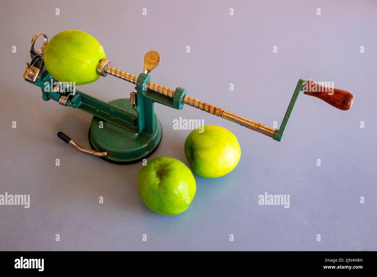 Apple coring and peeling device with cooking apples Stock Photo