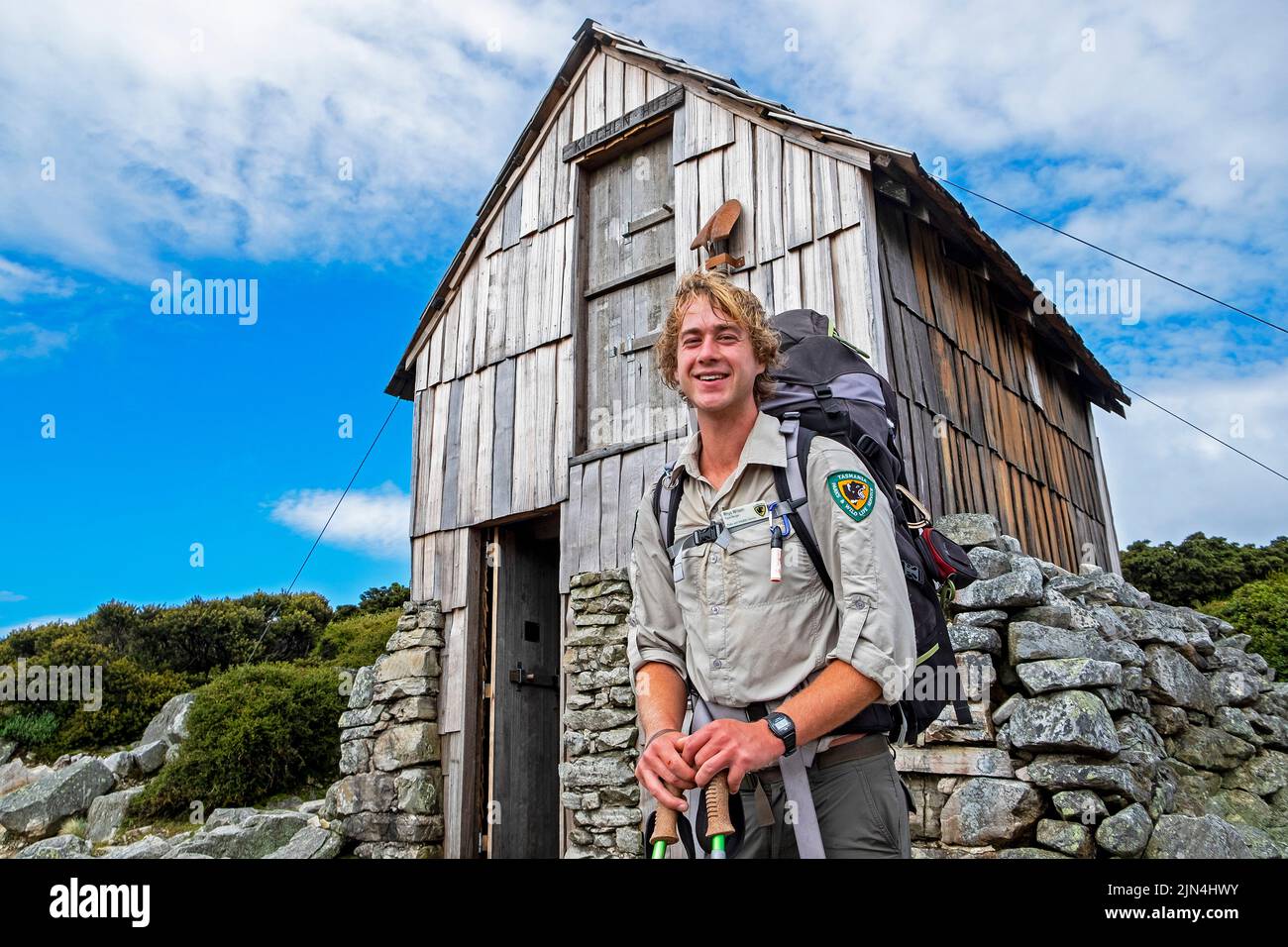 Young Parks and Wildlife Services ranger responsible fo hut maintenance at Kitchen Hut on the Overland Track near Cradle Mountain, Tasmania Stock Photo