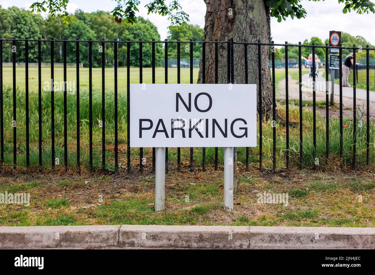 No Parking sign outside of a public park in the UK Stock Photo