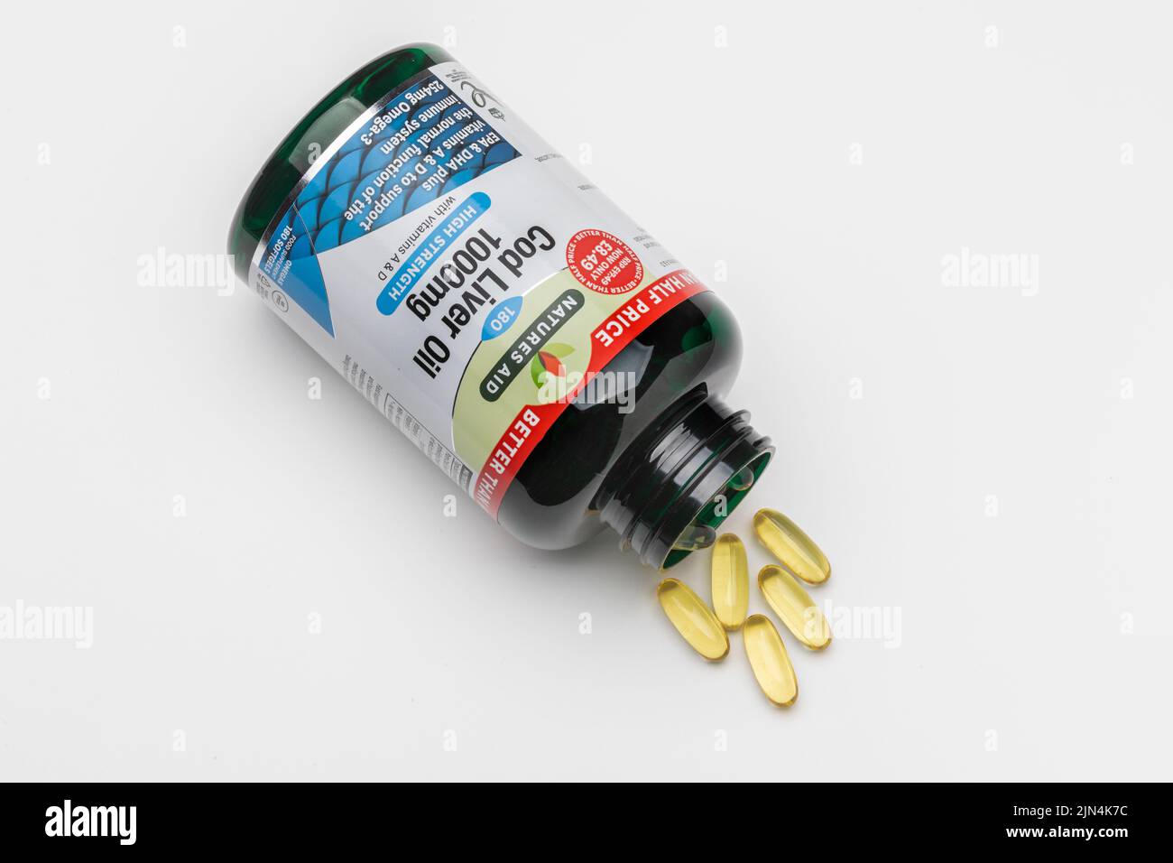 An open bottle of cod liver oil capsules Stock Photo