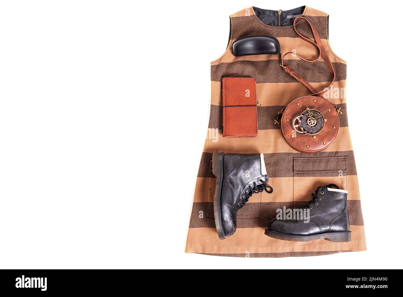 Stylish steampunk clothes and accessories outfit flat lay. Stock Photo