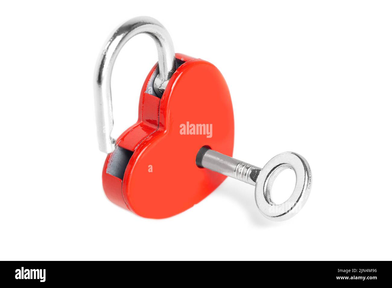 Open red heart-shaped padlock with a silver-toned key isolated on white ...