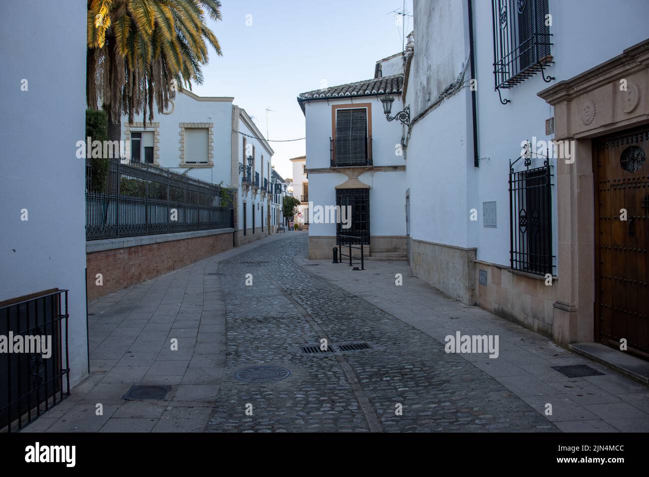 RONDA, ANDALUSIA, SPAIN - NOVEMBER 5,  2021 narrow streets and buildings in shadow in the old town Stock Photo