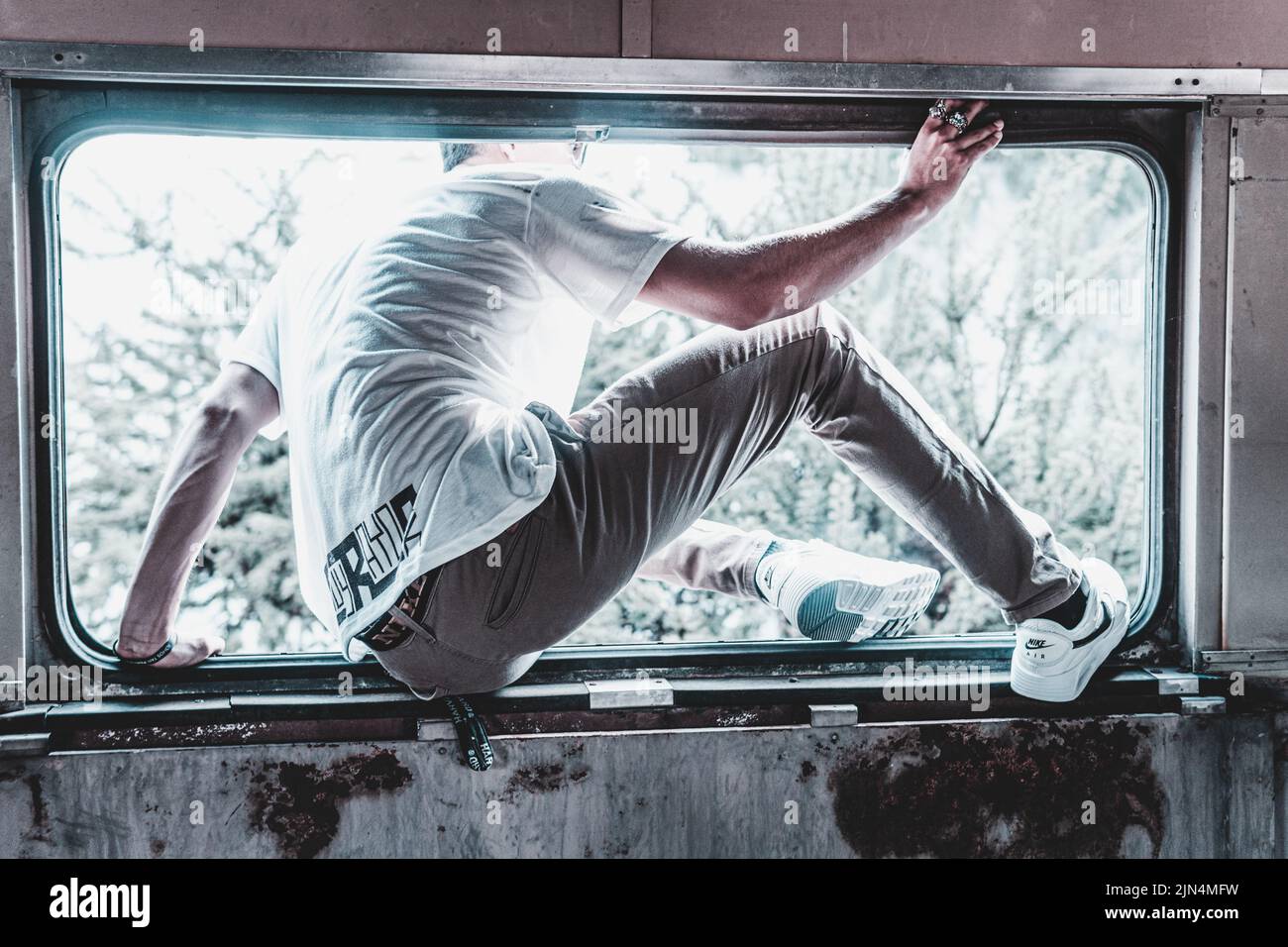 Man climb through window hires stock photography and images Alamy