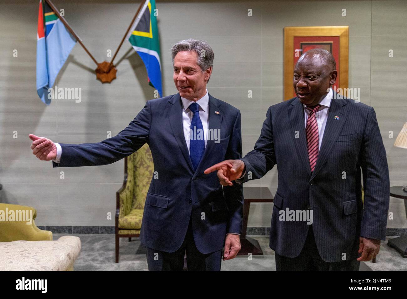 U.S. Secretary of State Antony Blinken, South Africa's President Cyril Ramaphosa ask South Africa's Foreign Minister Naledi Pandor (not in picture) to join them as they pose for a photo on the sidelines of their meeting at Waterkloof Airforce Base in Centurion, South Africa, August 9, 2022. Andrew Harnik/Pool via REUTERS        TPX IMAGES OF THE DAY Stock Photo