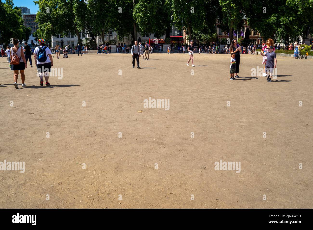 Parched area of Parliament Square, Westminster, London, UK, which is normally grass covered but has turned to dry dust in heatwave dry spell Stock Photo