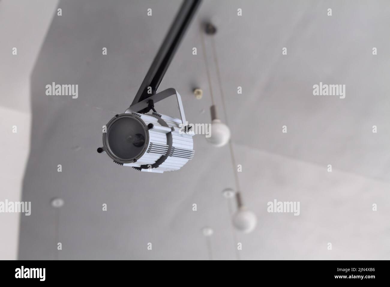 Accent spotlight on moving rail and ceiling lamps detailed photo Stock Photo