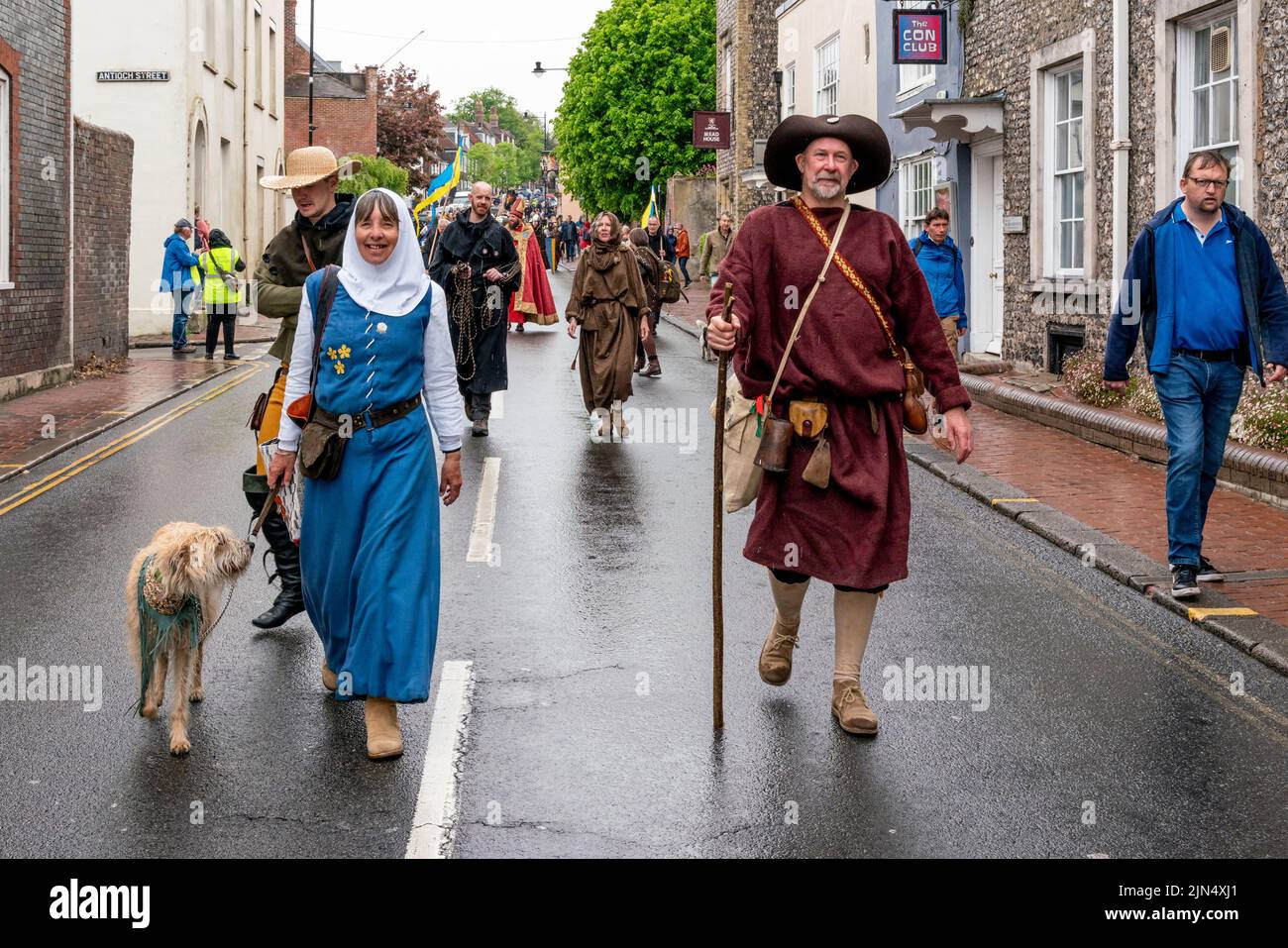 People In Medieval Costume Take Part In A Procession Through The Town ...