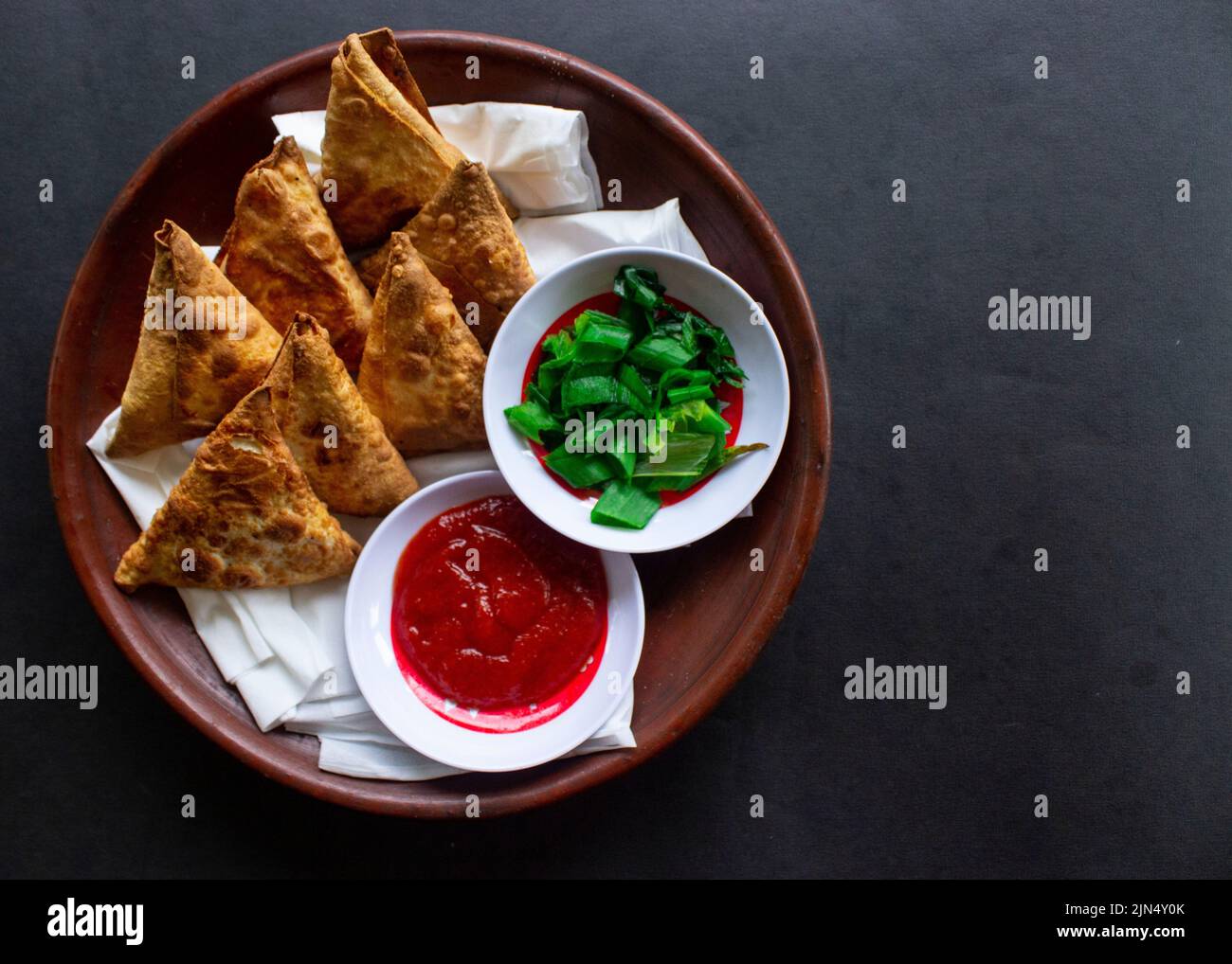 Triangular Samosa Samosa, samsa or somsa are triangular fried pastries or pastri served ...