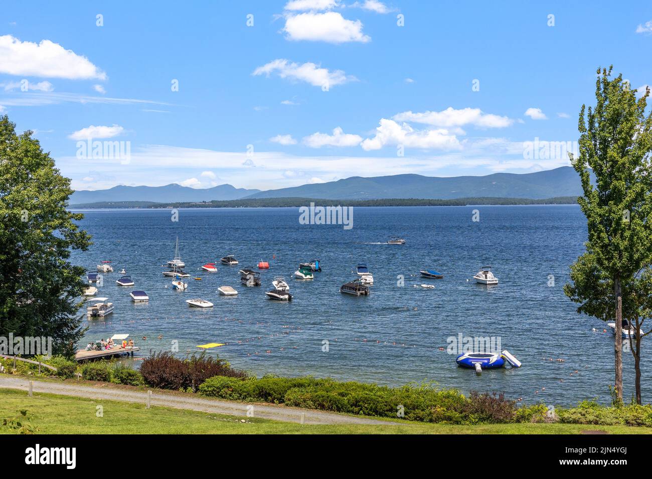 An aerial view of floating boat in lake Winnipesaukee in background of mountains Stock Photo Alamy