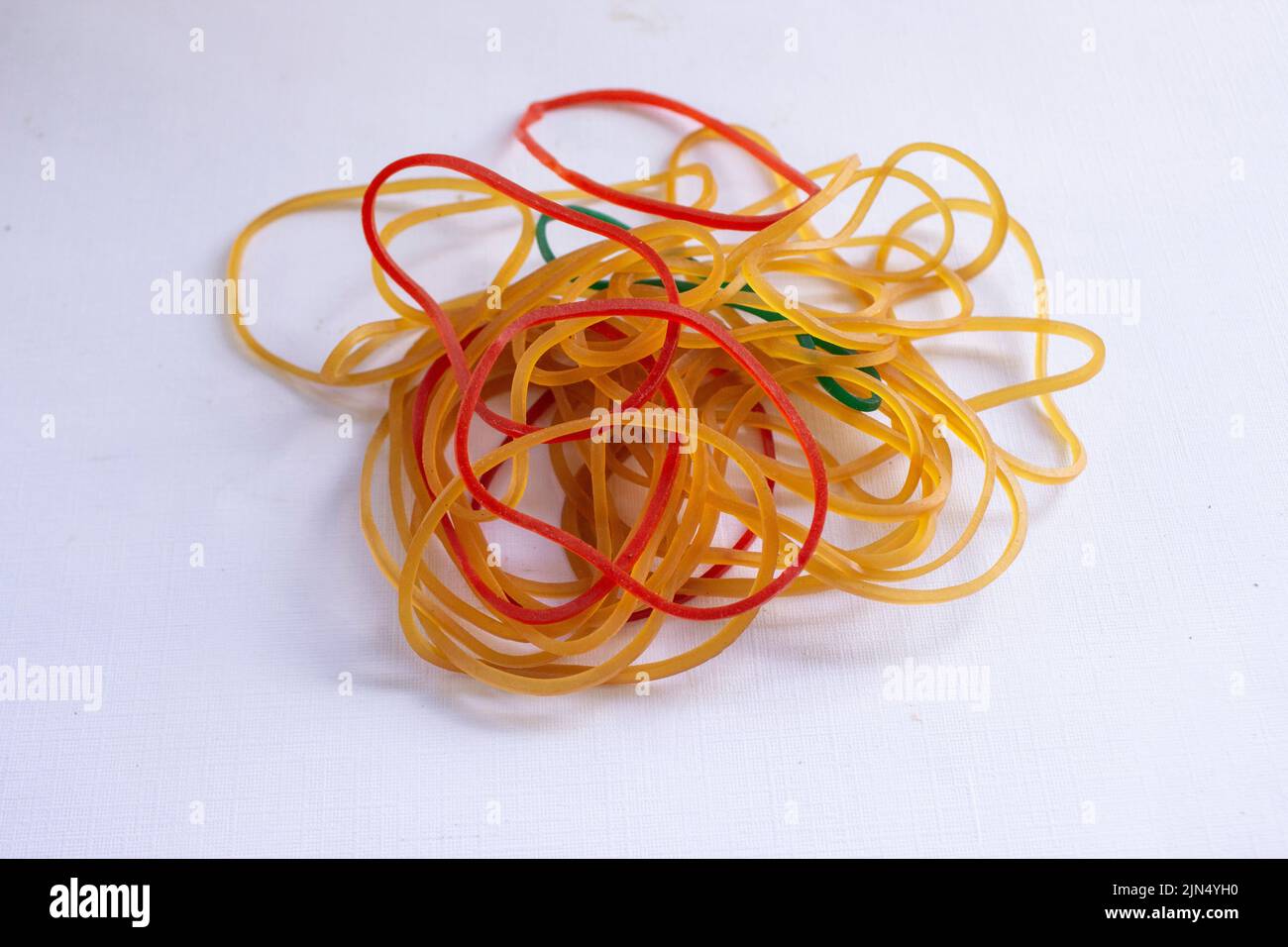 Red rubber band. Elastic bands. dragging an elastic band, isolated on