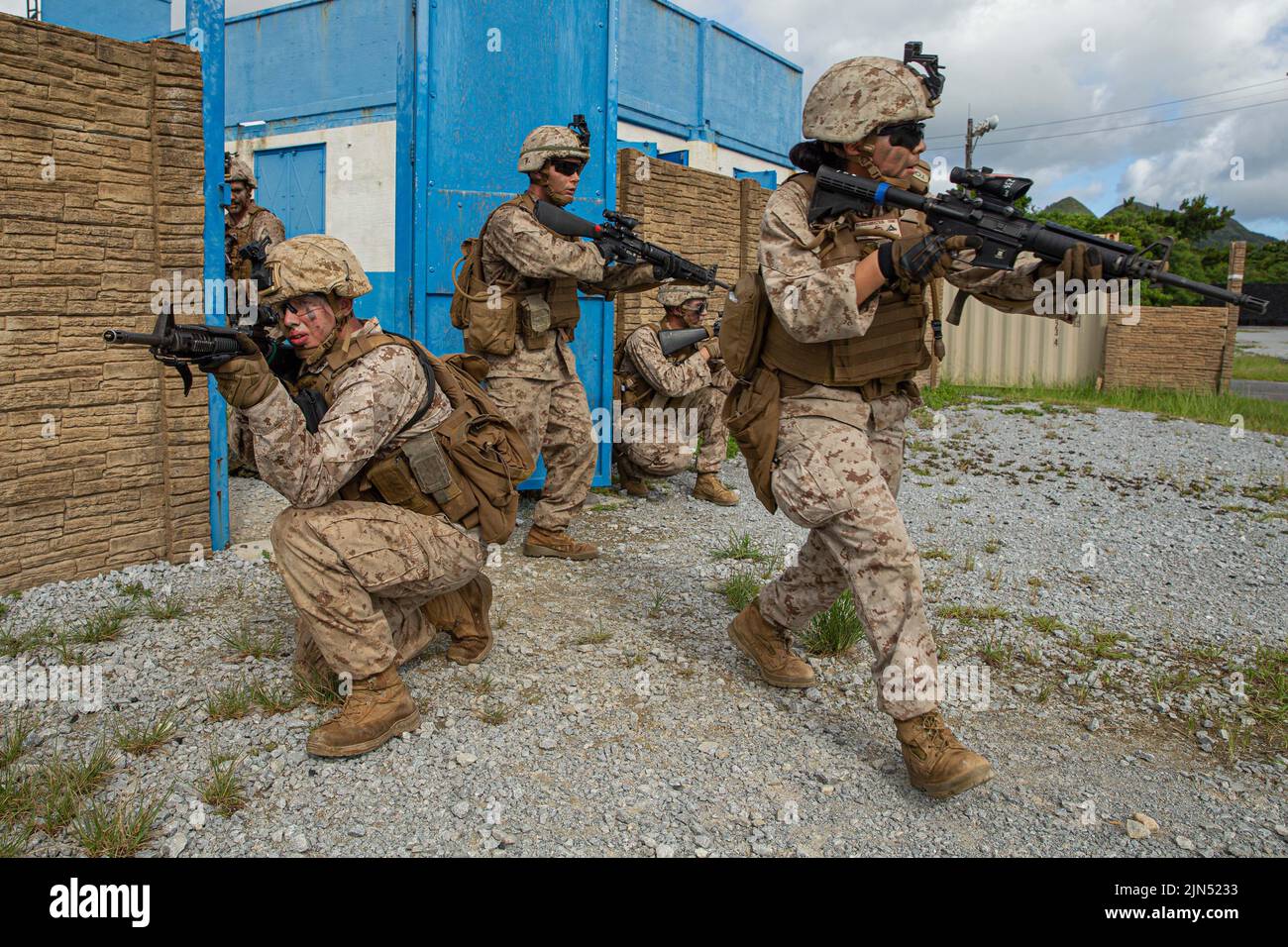 Camp Hansen, Okinawa, Japan. 19th July, 2022. U.S. Marines with 3rd Landing Support Battalion, Combat Logistics Regiment 3, 3rd Marine Logistics Group, conduct a building clearing drill at Military Operations in Urban Terrain Town, Eastern Training Area, Okinawa, Japan, July 19, 2022. 3rd MLG, based out of Okinawa, Japan, is a forward-deployed combat unit that serves as III MEF's comprehensive logistics and combat service support backbone for operations throughout the Indo-Pacific area of responsibility. Credit: U.S. Marines/ZUMA Press Wire Service/ZUMAPRESS.com/Alamy Live News Stock Photo