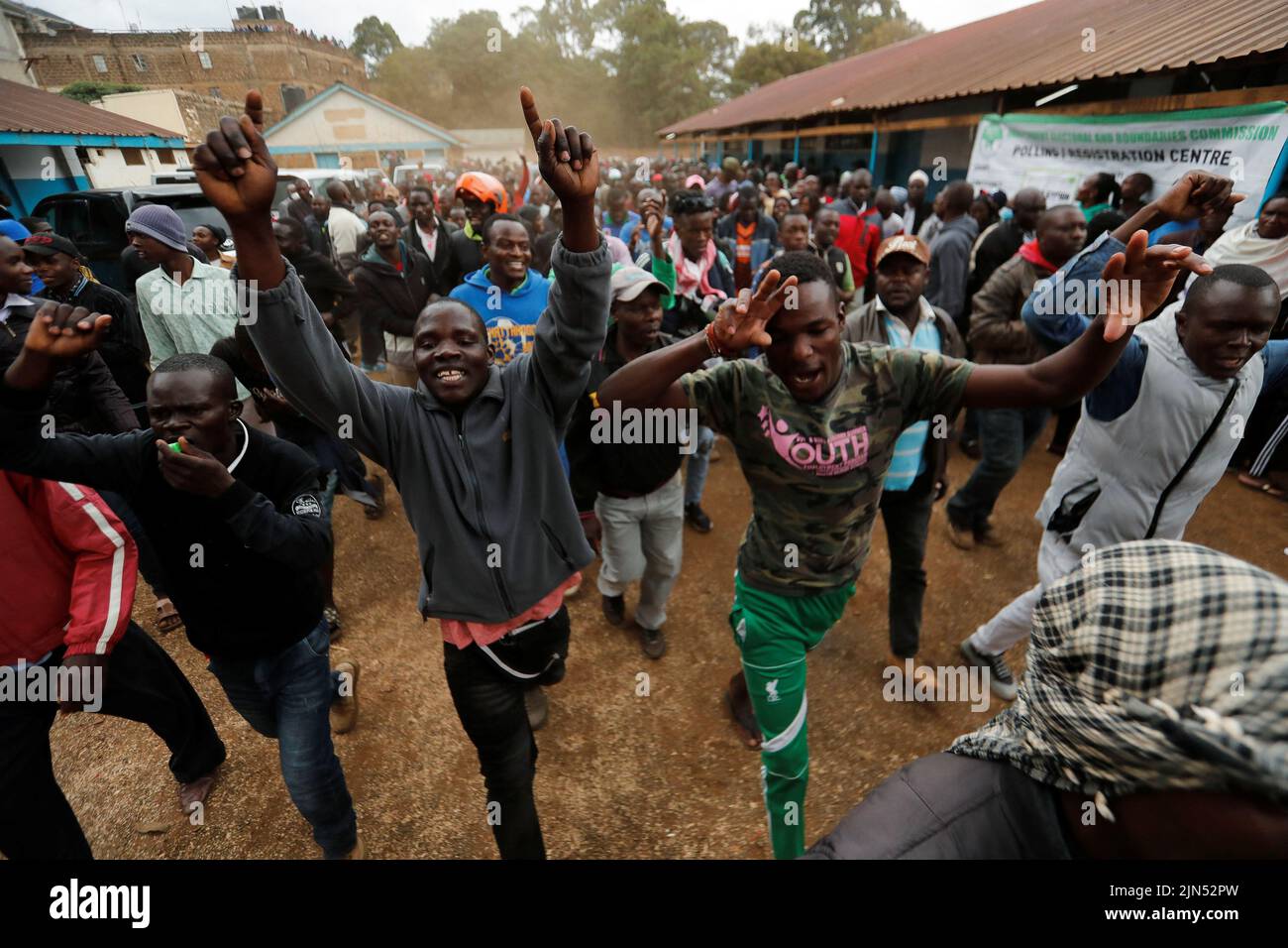 People react during the presidential election, outside the Kibera slums of Nairobi, Kenya August 9, 2022. REUTERS/Thomas Mukoya Stock Photo