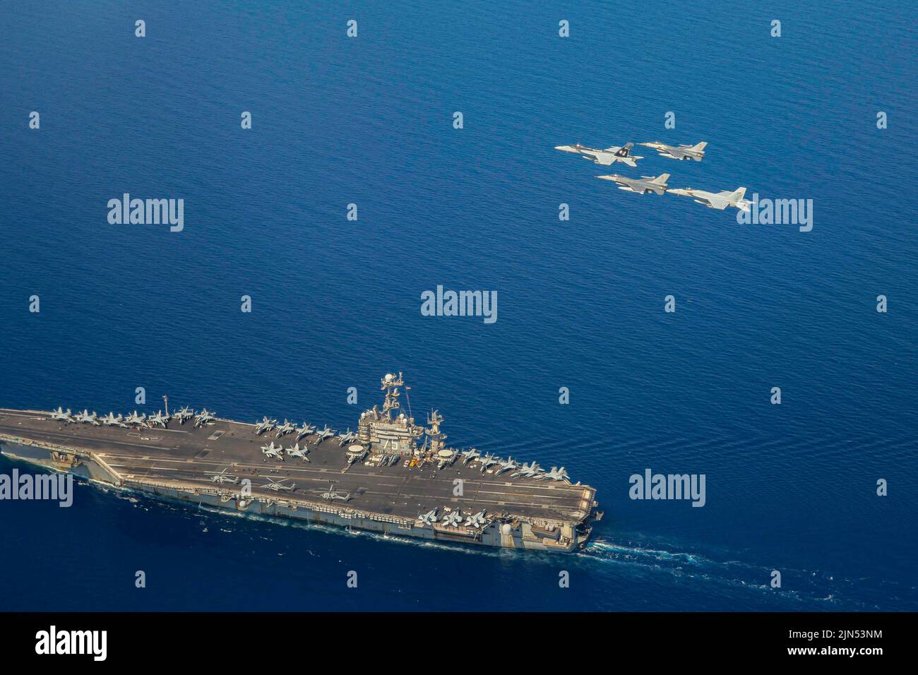 Mediterranean Sea. 29th July, 2022. F/A-18E Super Hornets attached to Carrier Air Wing 1 (CVW-1) and Belgian air force F-16s fly in formation over the Nimitz-class aircraft carrier USS Harry S. Truman (CVN 75), July 25, 2022. The Harry S. Truman Carrier Strike Group is on a scheduled deployment in the U.S. Naval Forces Europe area of operations, employed by U.S. 6th Fleet to defend U.S., allied and partner interests. Credit: U.S. Navy/ZUMA Press Wire Service/ZUMAPRESS.com/Alamy Live News Stock Photo