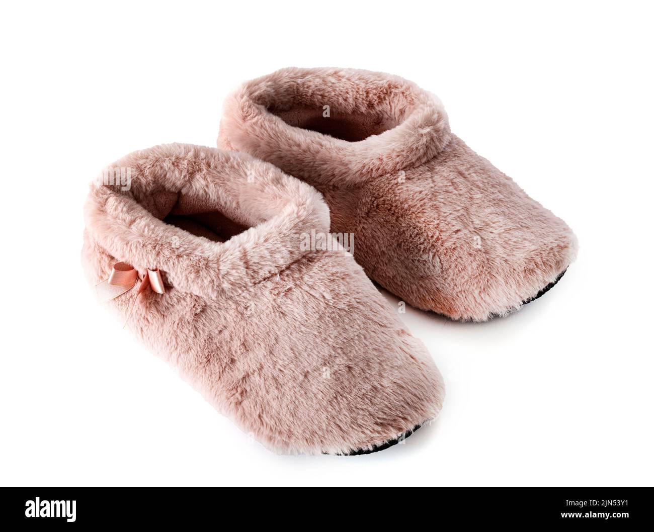 pink slippers in front of white background Stock Photo