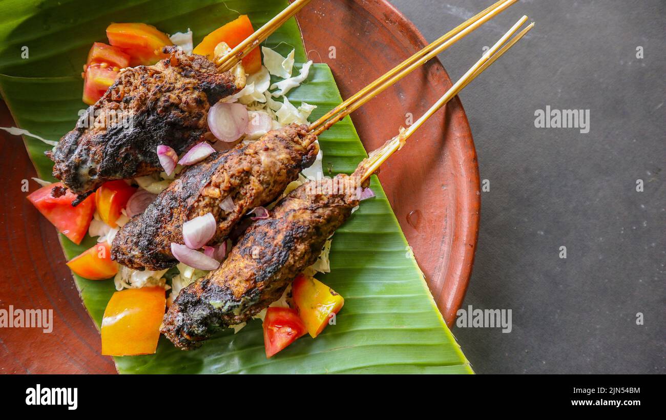 sate buntel or satay buntel is satay made from minced mutton wrapped in ...