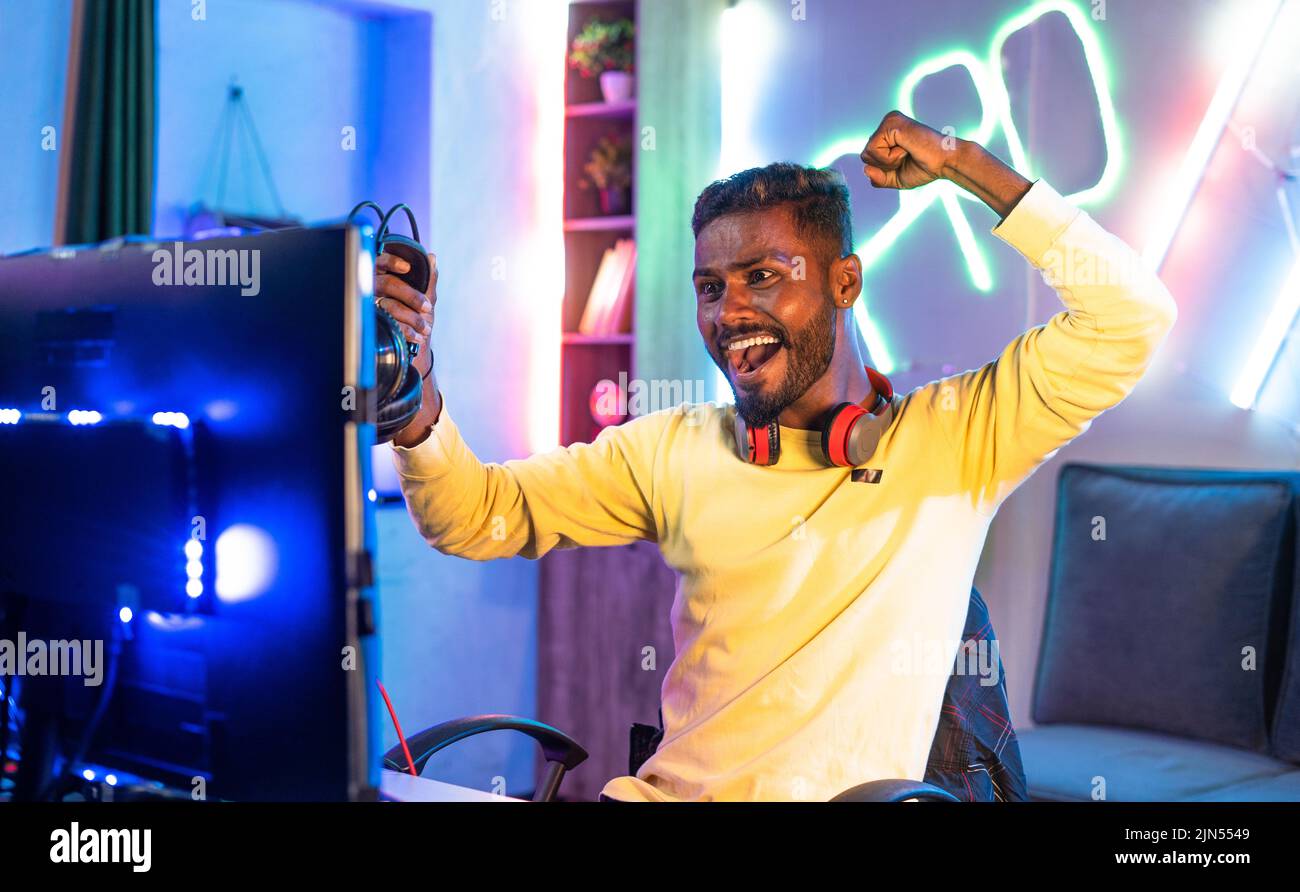 Cheerful pro gamer celebrating victory hi-res stock photography and ...