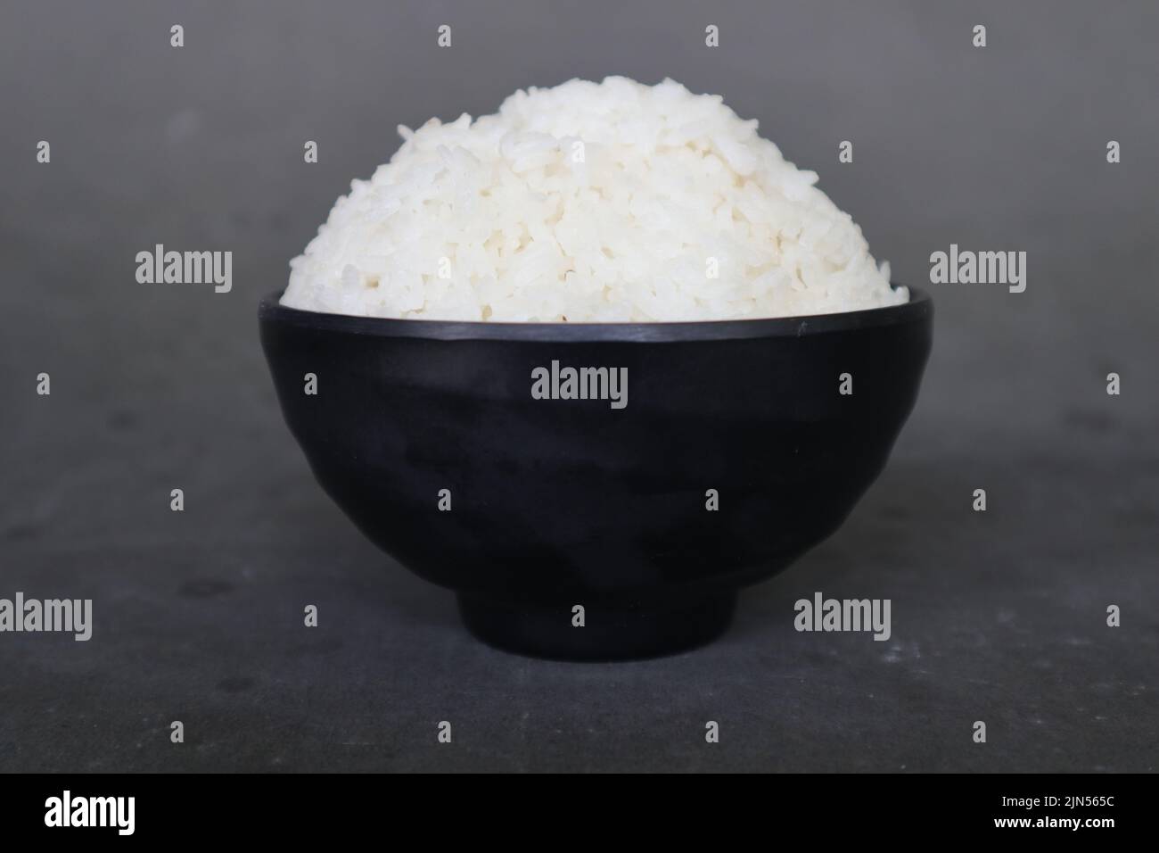 white steamed rice or nasi putih served in little bowl isolated on white background Stock Photo