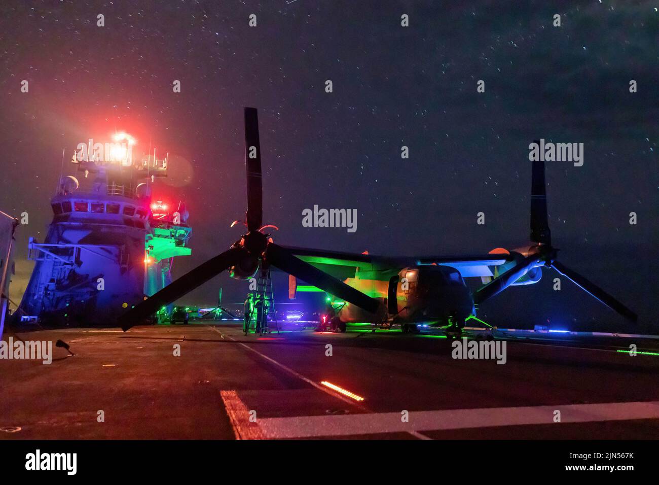 July 23, 2022 - Philippine Sea - Routine maintenance is conducted on U.S. Marine Corps MV-22B Osprey aboard Royal Australian Navy Canberra-class landing helicopter dock HMAS Canberra (L02) during Rim of the Pacific (RIMPAC) 2022. Twenty-six nations, 38 ships, three submarines, more than 170 aircraft and 25,000 personnel are participating in RIMPAC from June 29 to August. 4 in and around the Hawaiian Islands and Southern California. The world's largest international maritime exercise, RIMPAC provides a unique training opportunity while fostering and sustaining cooperative relationships among pa Stock Photo