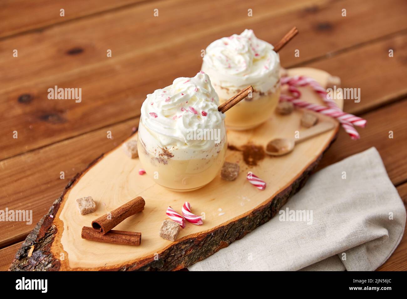 glasses of eggnog with whipped cream and anise Stock Photo - Alamy