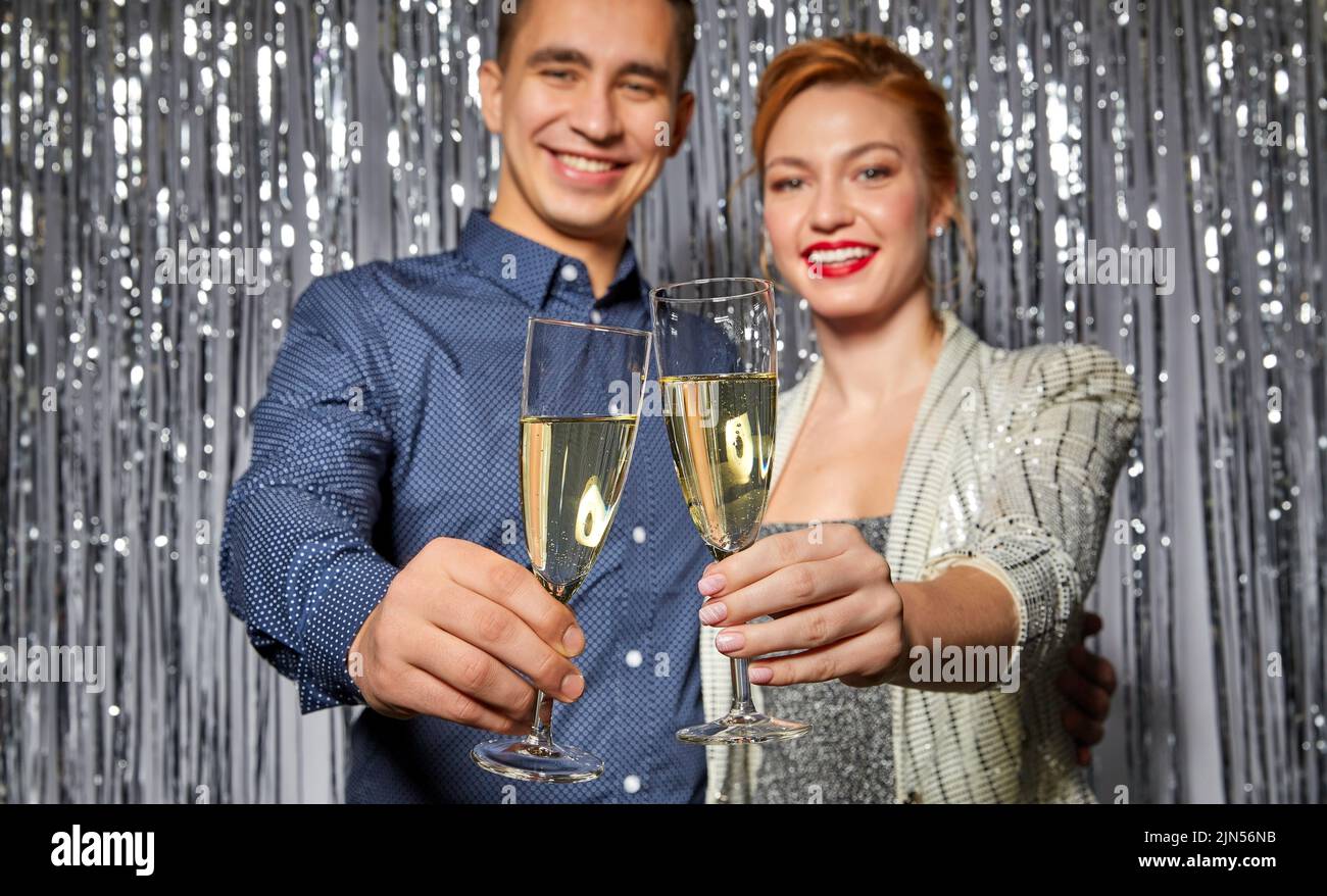 couple with champagne glasses at christmas party Stock Photo