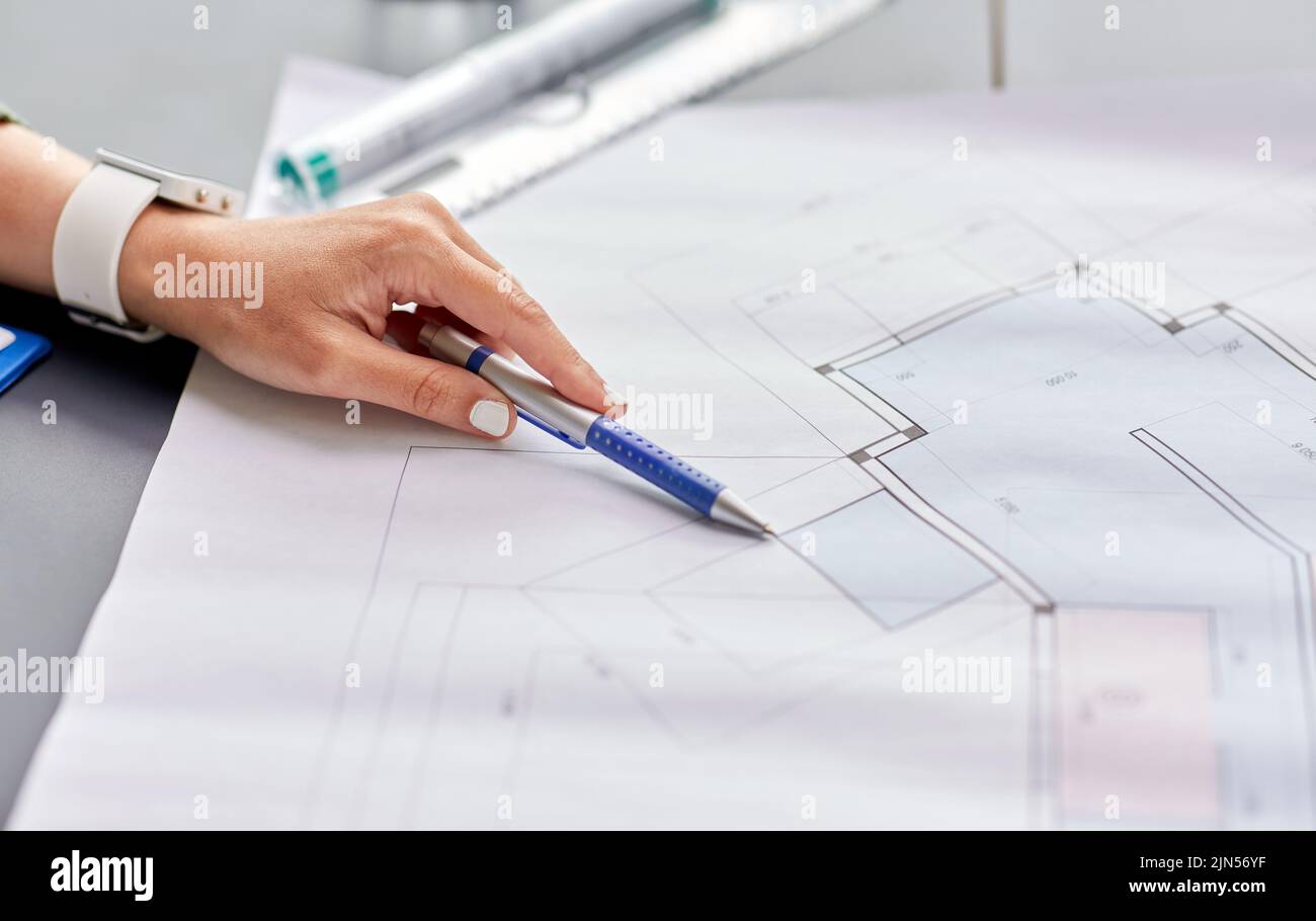 architect with blueprint working at office Stock Photo