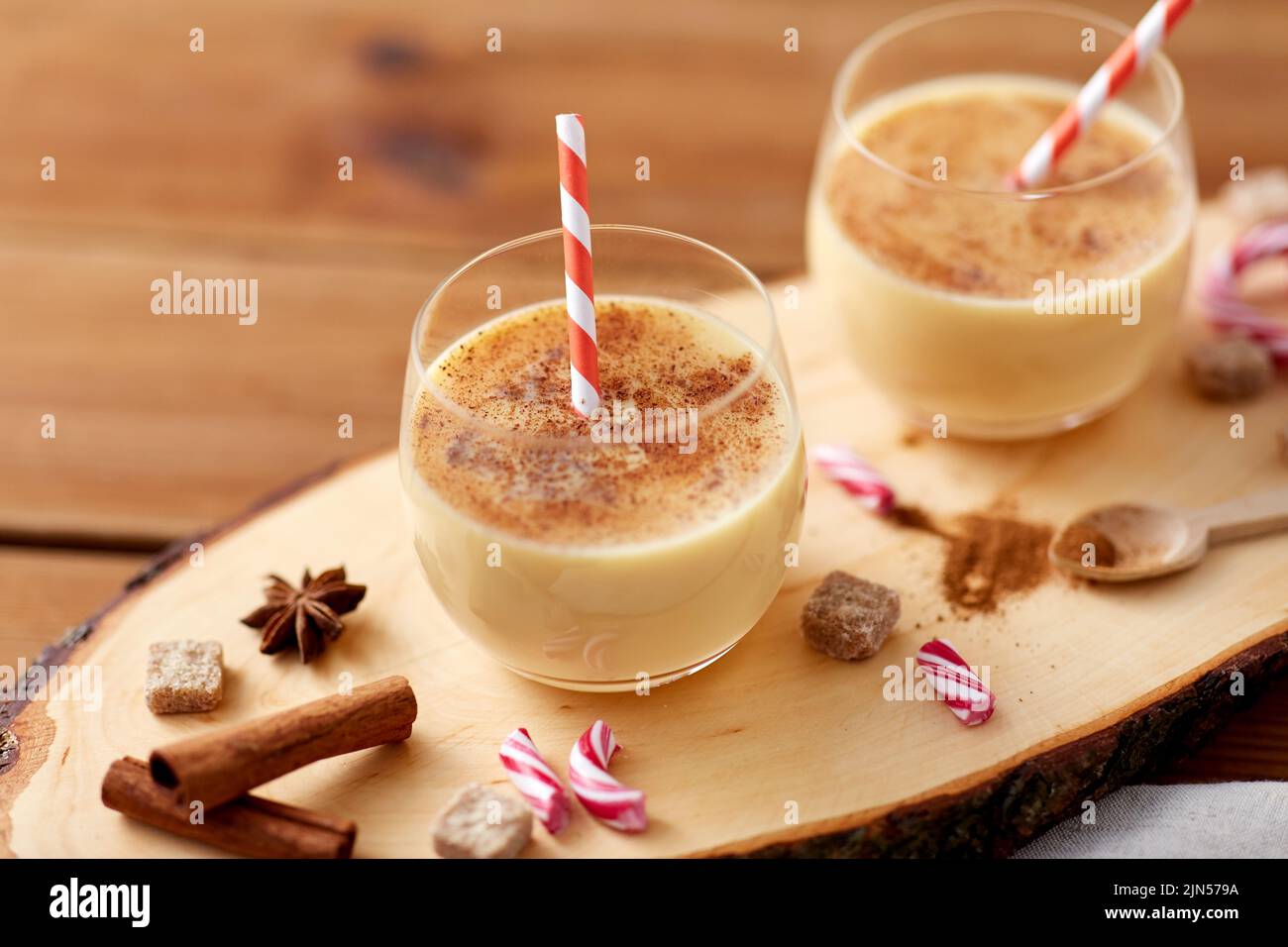 glasses of eggnog, ingredients and spices on wood Stock Photo