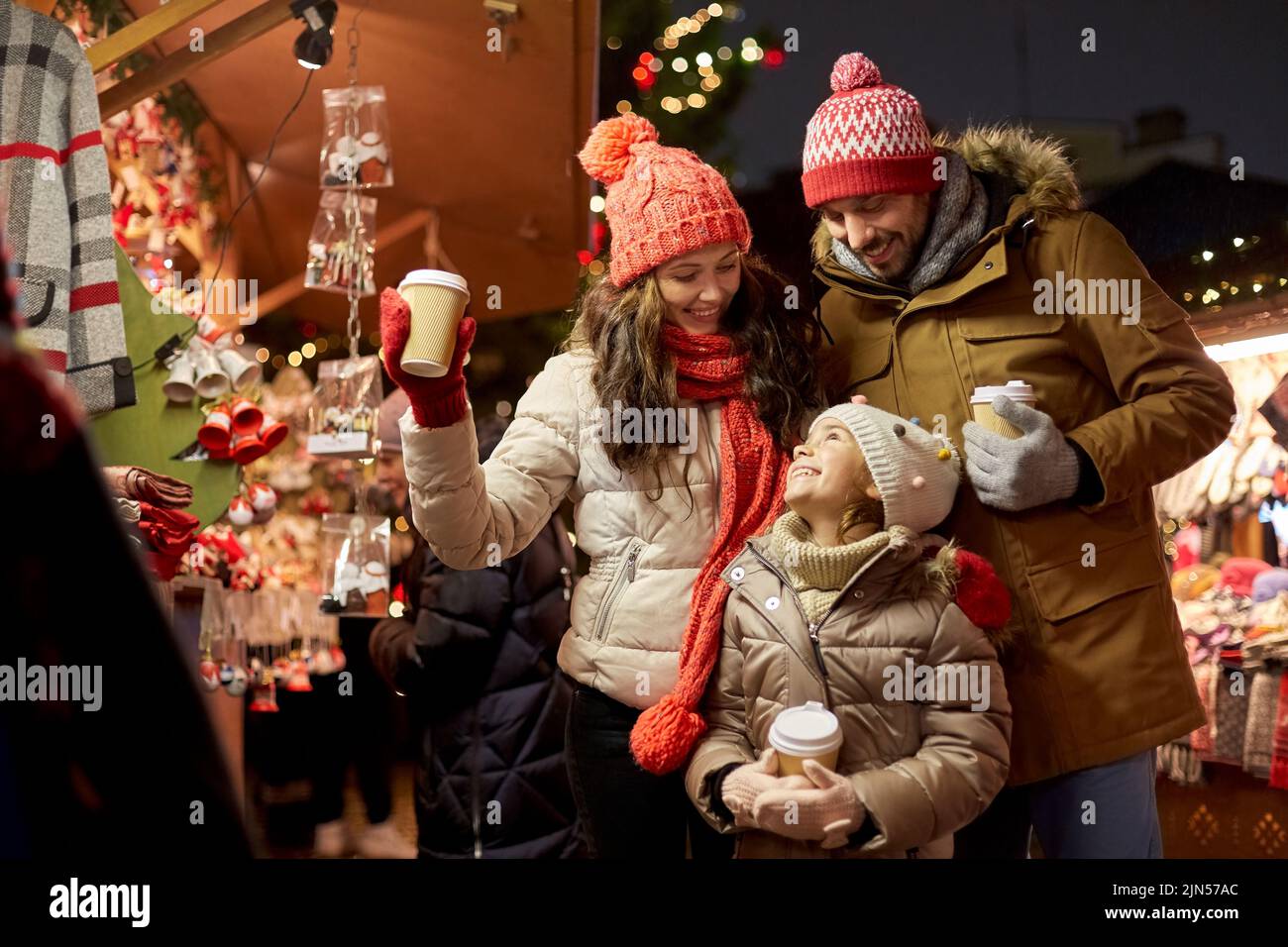 family with takeaway drinks at christmas market Stock Photo