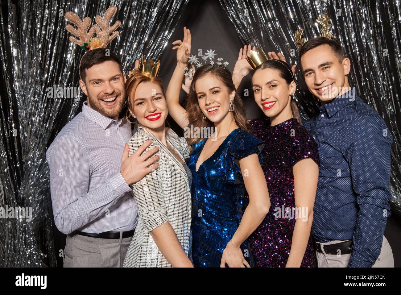 happy friends posing at christmas party Stock Photo - Alamy