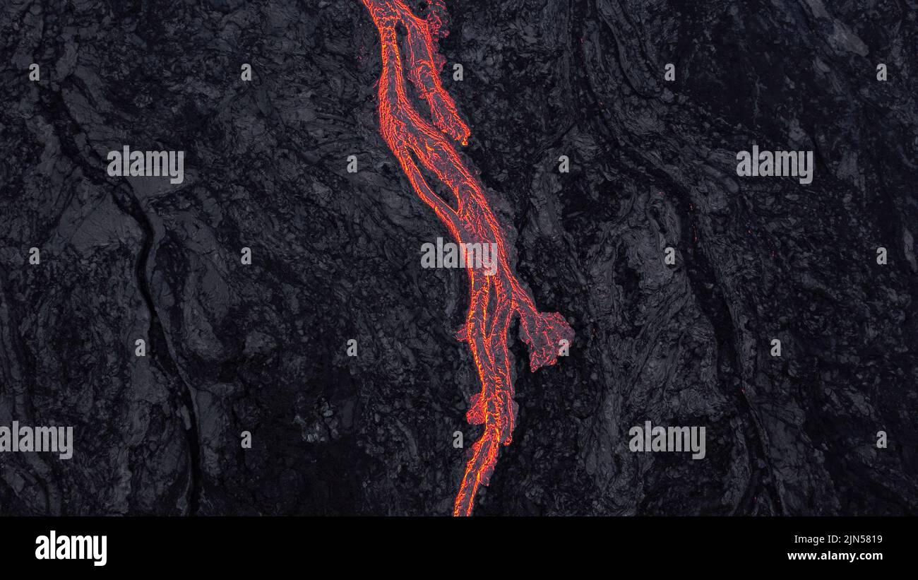 river-of-lava-flowing-on-solidified-lava-stock-photo-alamy