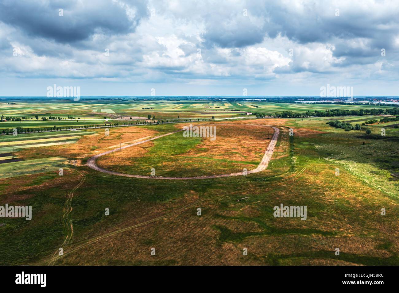 Aerial shot of old abandoned horse race track in plain landscape, drone pov high angle view Stock Photo
