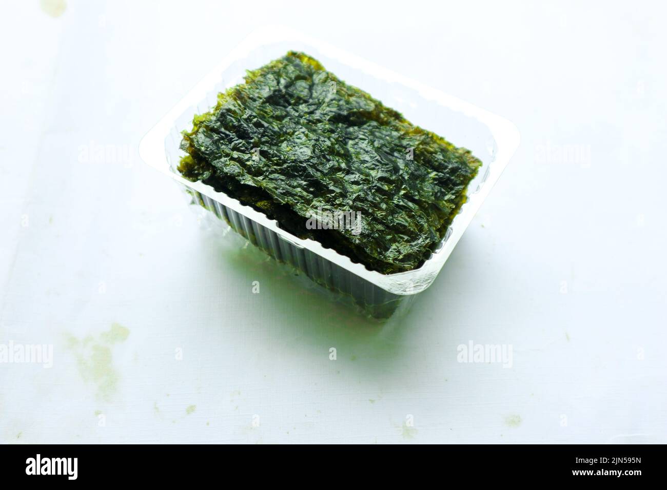 nori seaweed isolated on white background. Japanese food nori. Dry seaweed sheets. Stock Photo