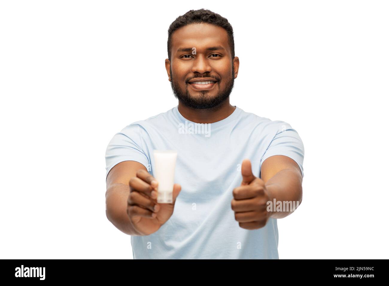 african man with moisturizer showing thumbs up Stock Photo