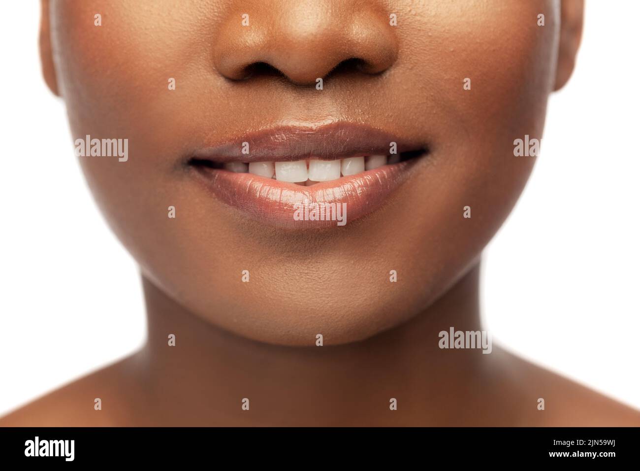 close up of face of smiling african american woman Stock Photo