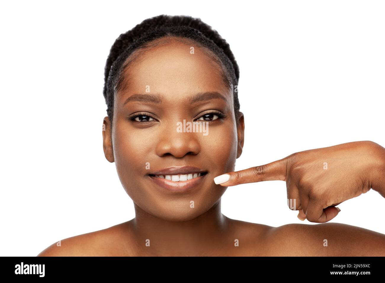 african american woman pointing to her mouth Stock Photo