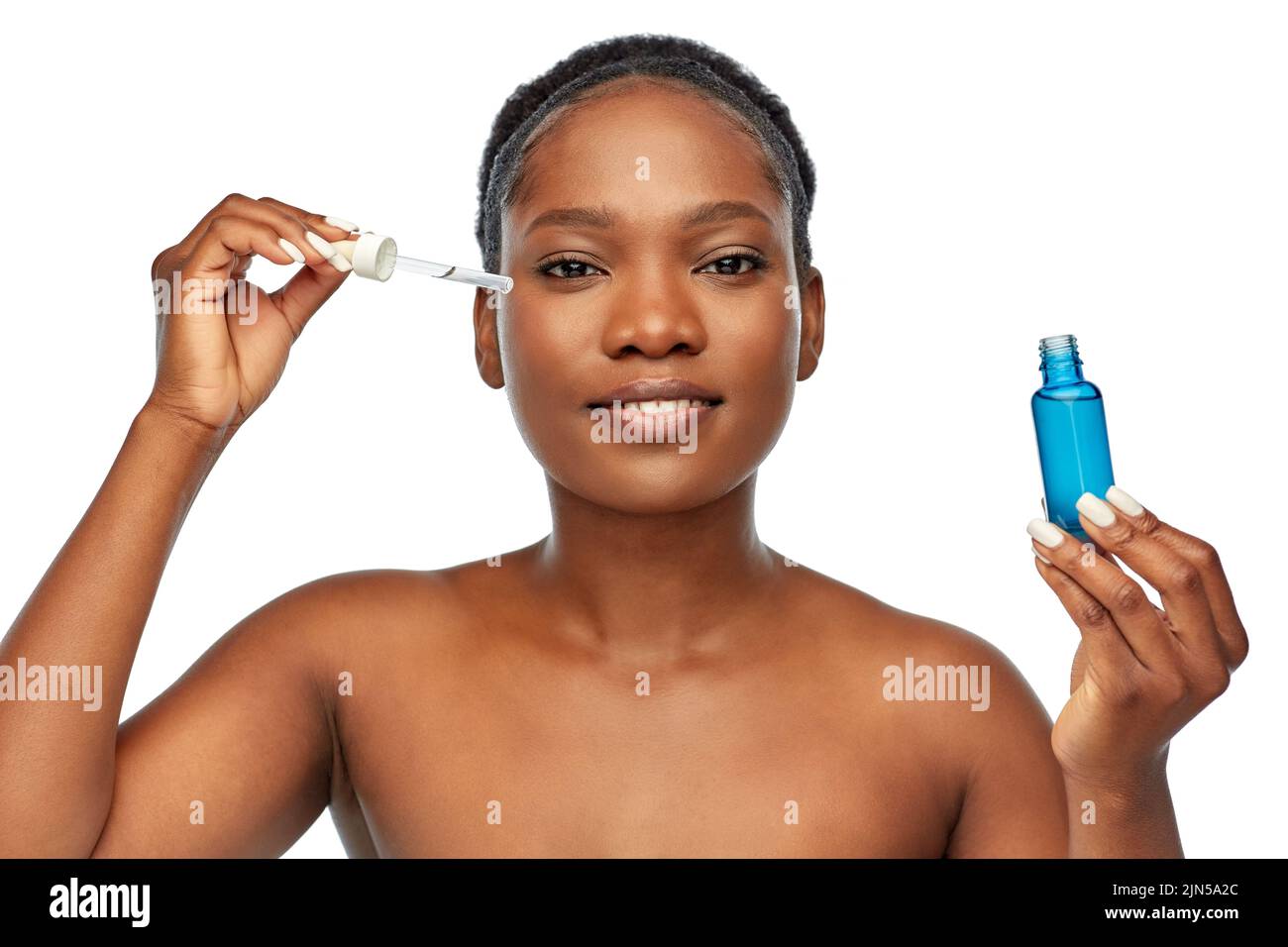 african american woman with bottle of serum Stock Photo