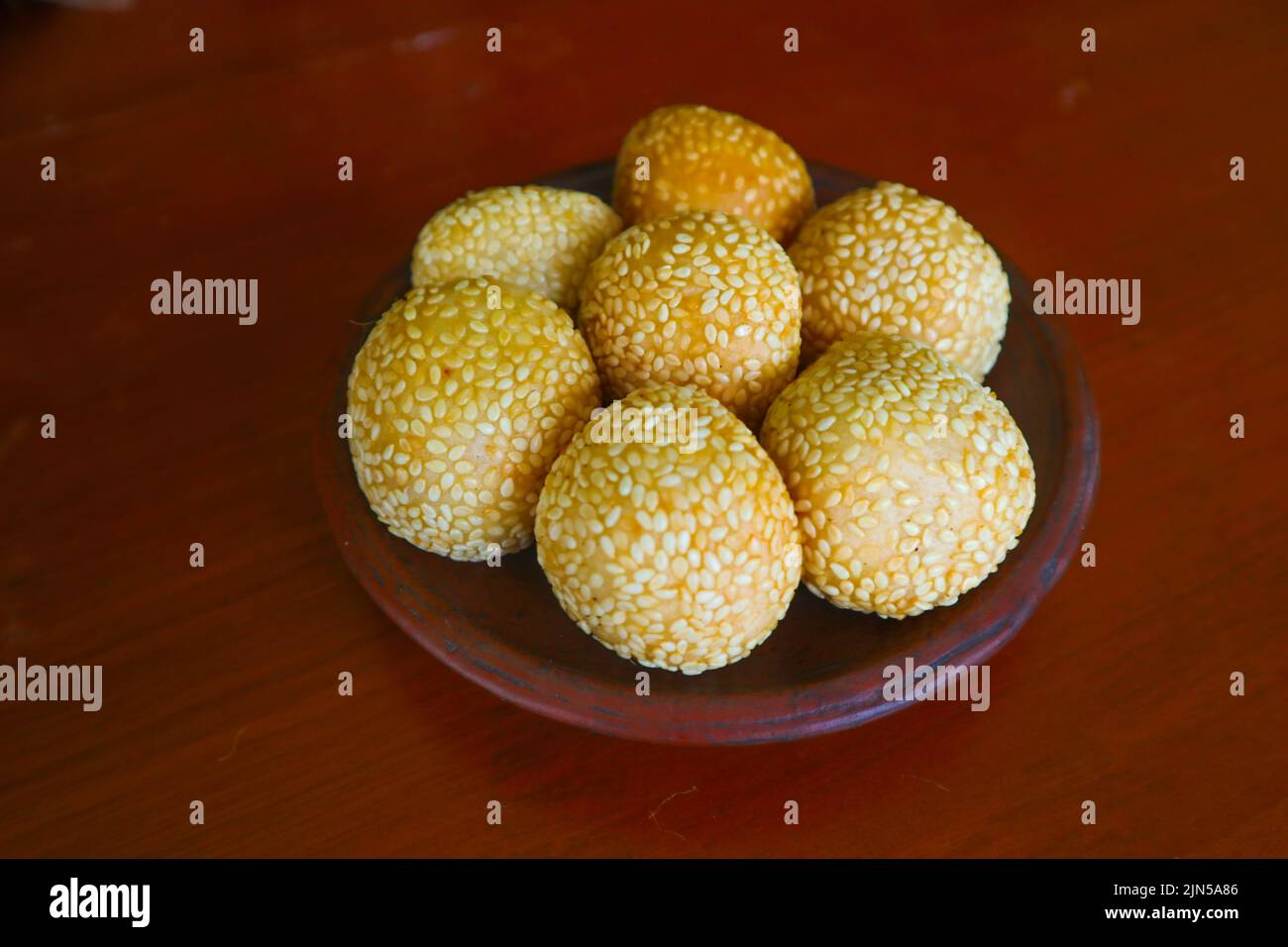 'onde-onde or sesame ball or Jian Dui is fried Chinese pastry made from glutinous rice flour and coated with sesame seeds filled with bean paste. isol Stock Photo