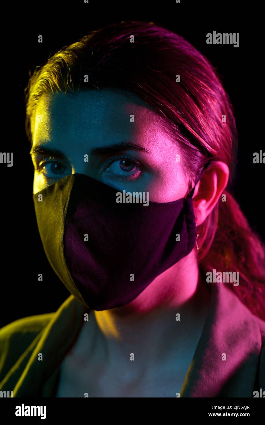 young woman wearing reusable protective mask Stock Photo