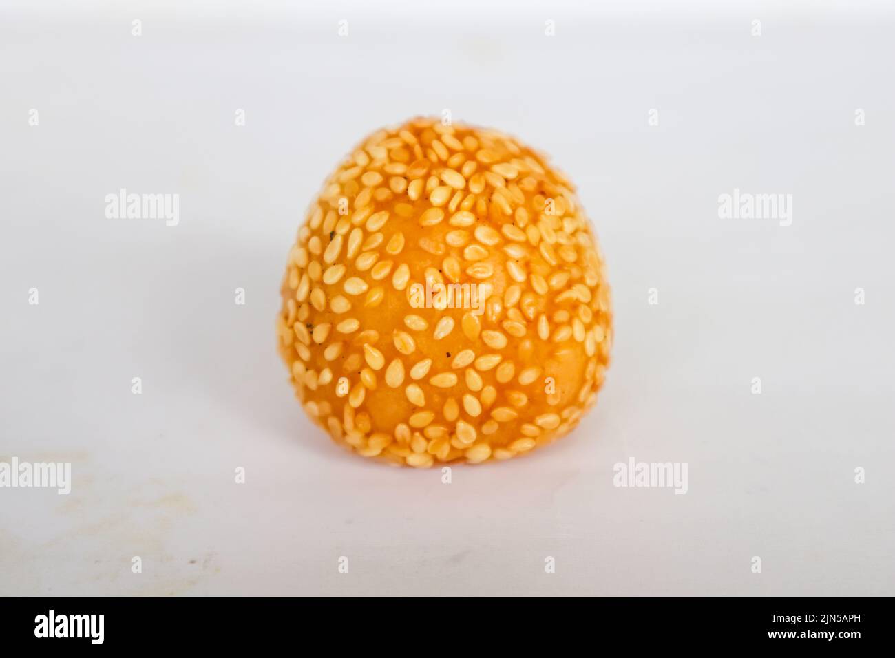 onde-onde or sesame ball or Jian Dui is fried Chinese pastry made from glutinous rice flour and coated with sesame seeds filled with bean paste. Stock Photo