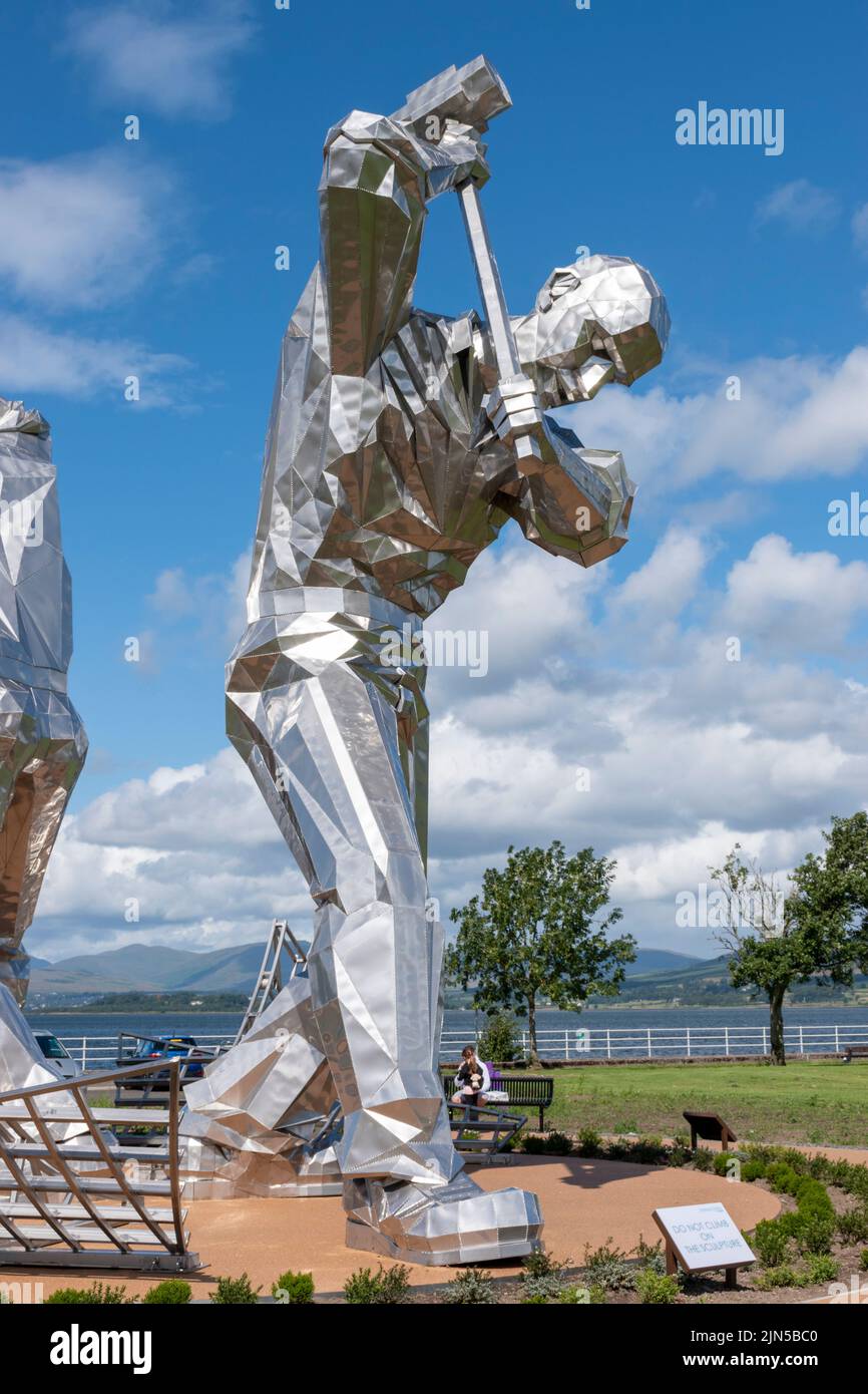 “The Skelpies”, “The Shipbuilders of Port Glasgow” sculpture by John McKenna alongside the River Clyde in Coronation Park, Port Glasgow, Scotland Stock Photo