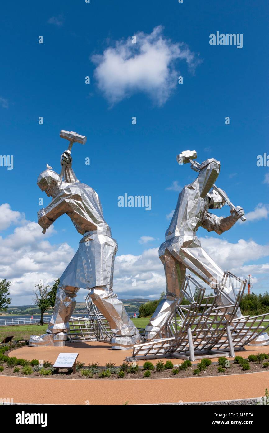 “The Skelpies”, “The Shipbuilders of Port Glasgow” sculpture by John McKenna alongside the River Clyde in Coronation Park, Port Glasgow, Scotland Stock Photo