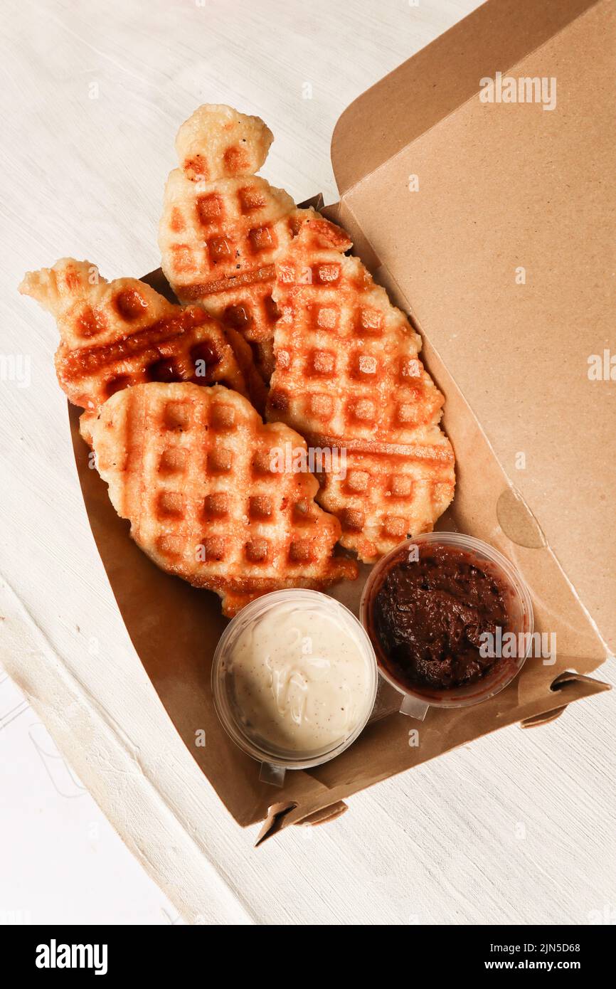 Croissant Waffle or Croffle with chocolate sauce served in box and ...
