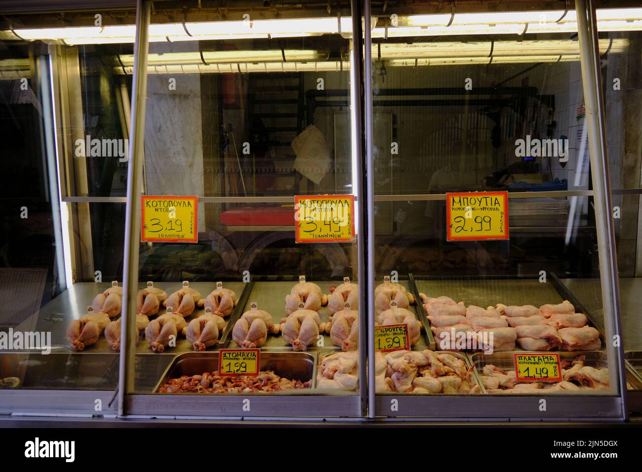 butcher's chickens in display cabinet inside the Central Municipal Athens Market in Psyri Stock Photo